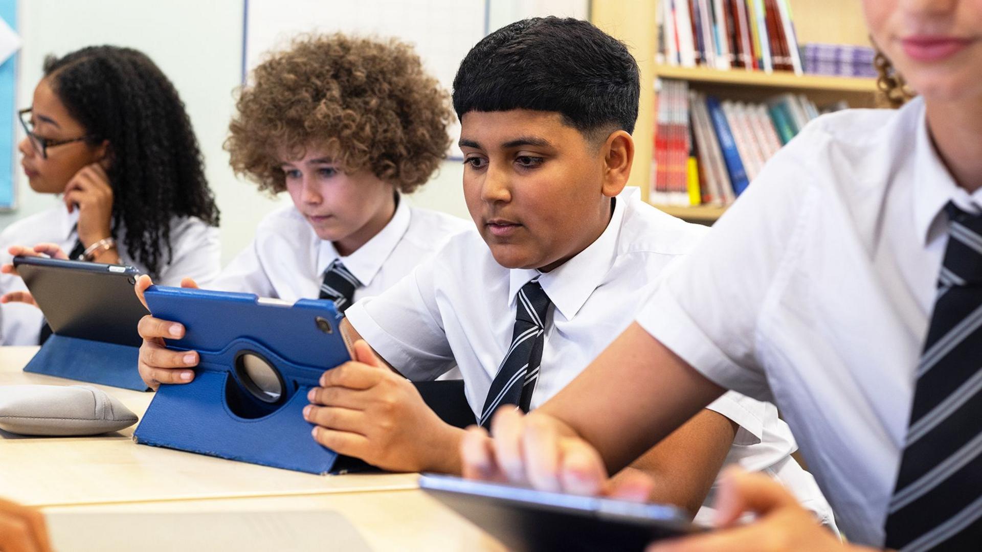 Cut screen time in classrooms to avoid long-term health issues, clinicians urge